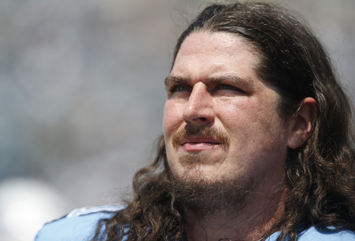 Tennessee Titans offensive tackle Dennis Kelly (71) looks over the field during the first quarter of a football game against the Jacksonville Jaguars at EverBank Field.