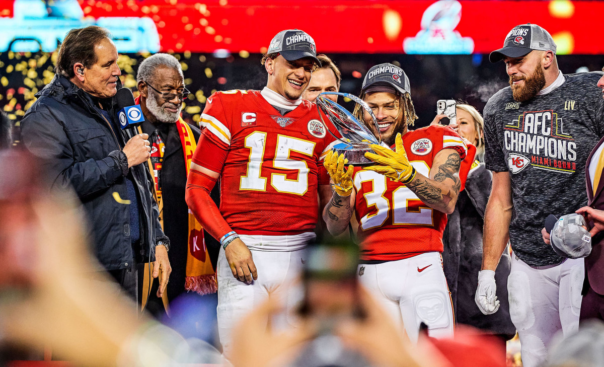 Chiefs stars Patrick Mahomes, Tyrann Mathieu and Travis Kelce celebrating with the Lamar Hunt Trophy after defeating the Titans in the AFC championship game