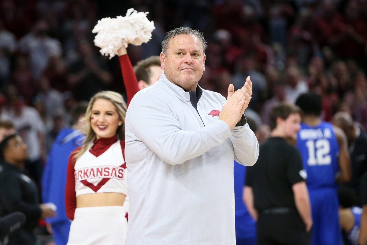 Sam Pittman, shown at a basketball game being introduced to the crowd, knows recruiting in the SEC and in Oklahoma from being on the late John Blake's staff at OU.