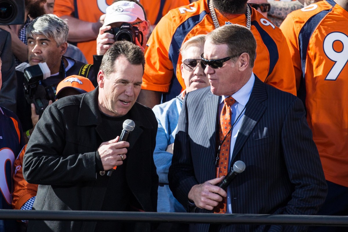 Former Browns wide receiver Dave Logan (right) interviews Broncos head coach Gary Kubiak during the Super Bowl 50 championship parade celebration. Logan has worked as a radio broadcaster for the Broncos since retiring.