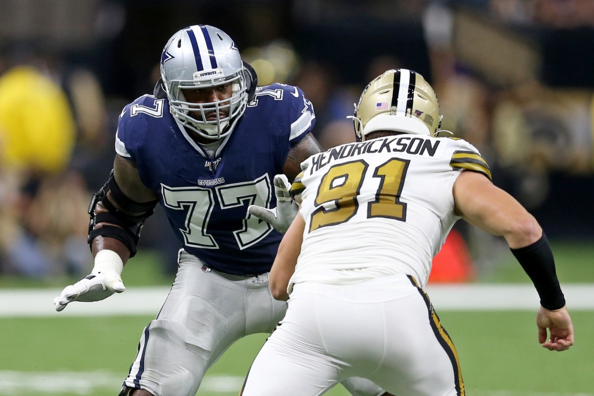 Sep 29, 2019; New Orleans, LA, USA; Dallas Cowboys offensive tackle Tyron Smith (77) blocks New Orleans Saints defensive end Trey Hendrickson (91) in the first quarter at the Mercedes-Benz Superdome. Mandatory Credit: Chuck Cook-USA TODAY Sports