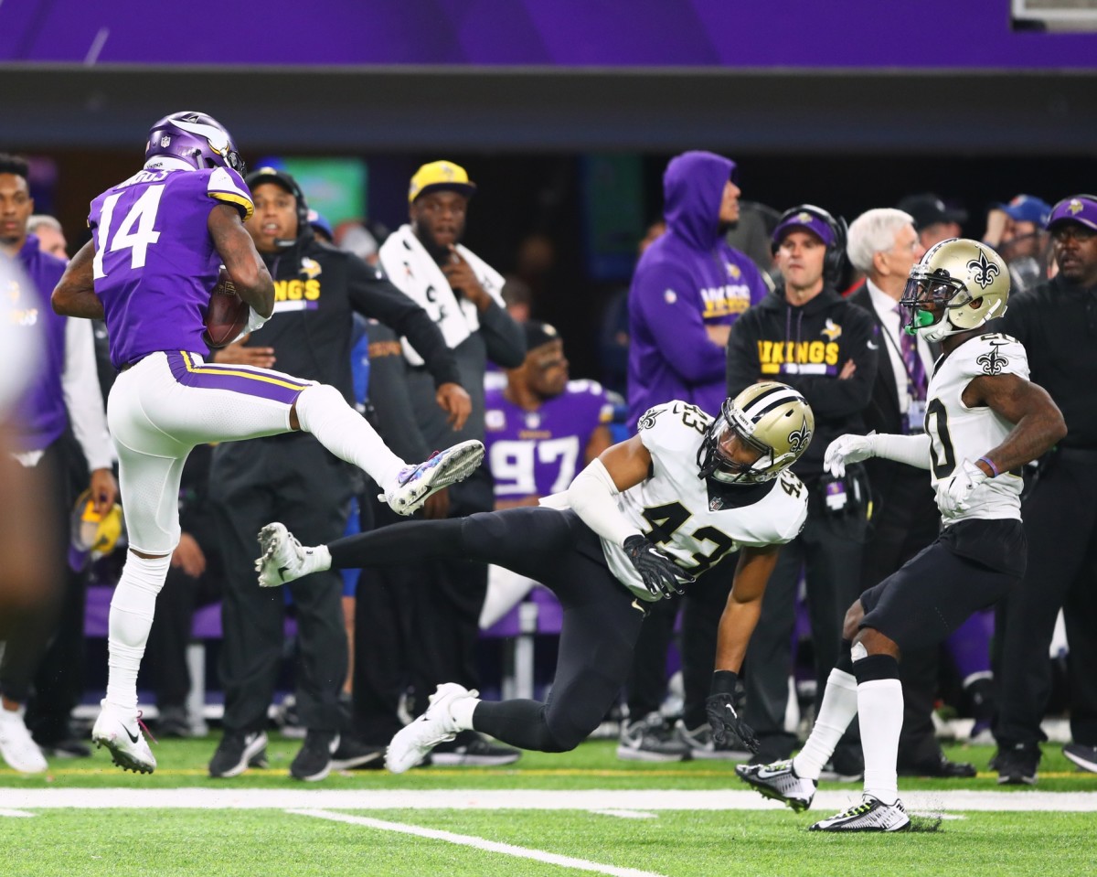 Jan 14, 2018; Minneapolis, MN, USA; Minnesota Vikings wide receiver Stefon Diggs catches the game winning touchdown as New Orleans Saints safety Marcus Williams (43) misses the tackle and collides with cornerback Ken Crawley (20) in the fourth quarter at U.S. Bank Stadium. Mandatory Credit: Mark J. Rebilas-USA TODAY Sports