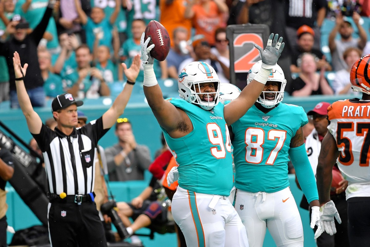 Miami Dolphins Christian Wilkins (94) scores a touchdown during the first half against the Cincinnati Bengals at Hard Rock Stadium. (Steve Mitchell-USA TODAY Sports)