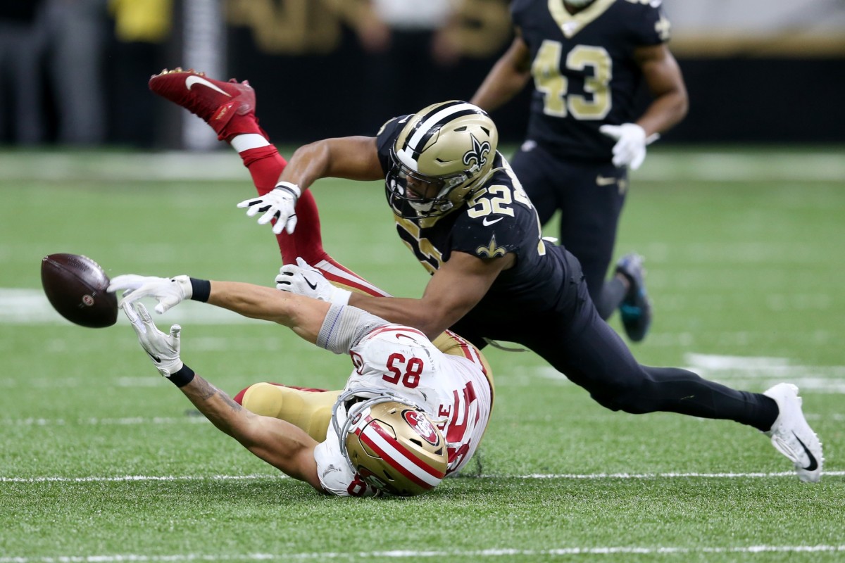 Dec 8, 2019; New Orleans, LA, USA; San Francisco 49ers tight end George Kittle (85) reaches for a pass as New Orleans Saints linebacker Craig Robertson (52) defends in the second half at the Mercedes-Benz Superdome. The 49ers won, 48-46. Mandatory Credit: Chuck Cook-USA TODAY Sports