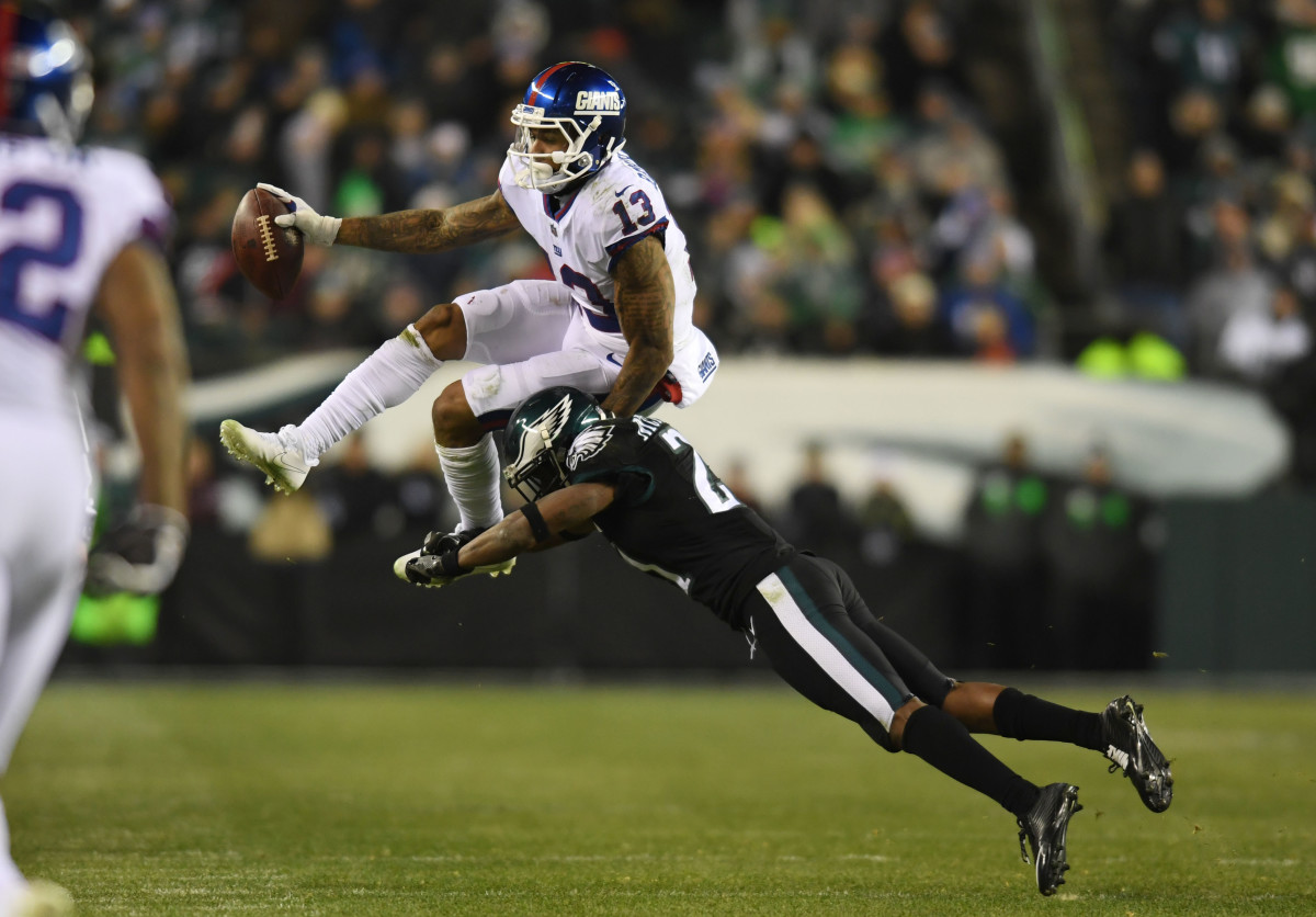 Odell Beckham Jr. leaps in an attempt to evade a tackle by the Eagles, Dec. 22, 2016.