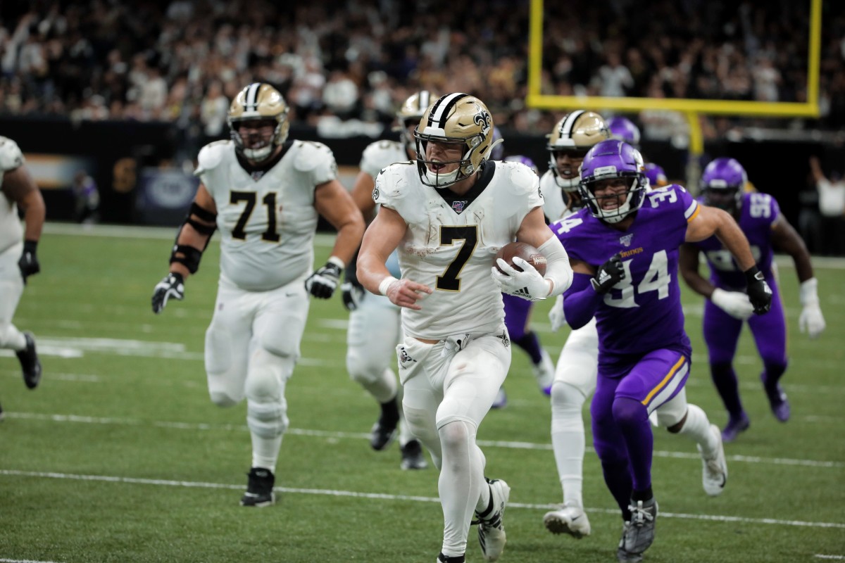 Jan 5, 2020; New Orleans, Louisiana, USA; New Orleans Saints player Taysom Hill (7) against past Minnesota Vikings strong safety Andrew Sendejo (34) during the fourth quarter of a NFC Wild Card playoff football game at the Mercedes-Benz Superdome. Mandatory Credit: Derick Hingle-USA TODAY Sports