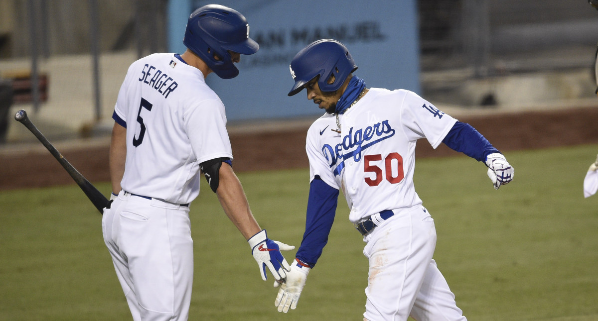 Los Angeles Dodgers right fielder Mookie Betts (50) celebrates his solo home run with shortstop Corey Seager (5) during the fourth inning against the San Diego Padres at Dodger Stadium.