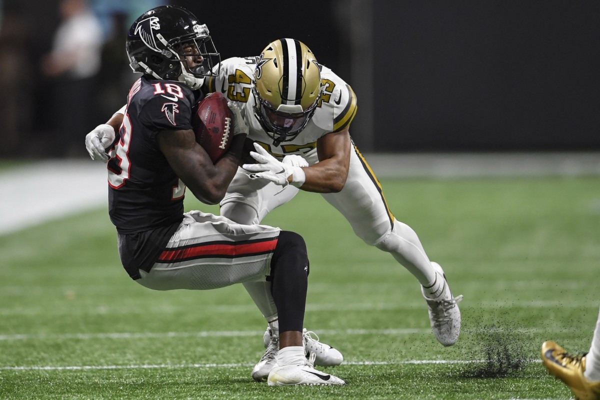 Nov 28, 2019; Atlanta, GA, USA; New Orleans Saints free safety Marcus Williams (43) tackles Atlanta Falcons wide receiver Calvin Ridley (18) after a catch during the second half at Mercedes-Benz Stadium. Mandatory Credit: Dale Zanine-USA TODAY