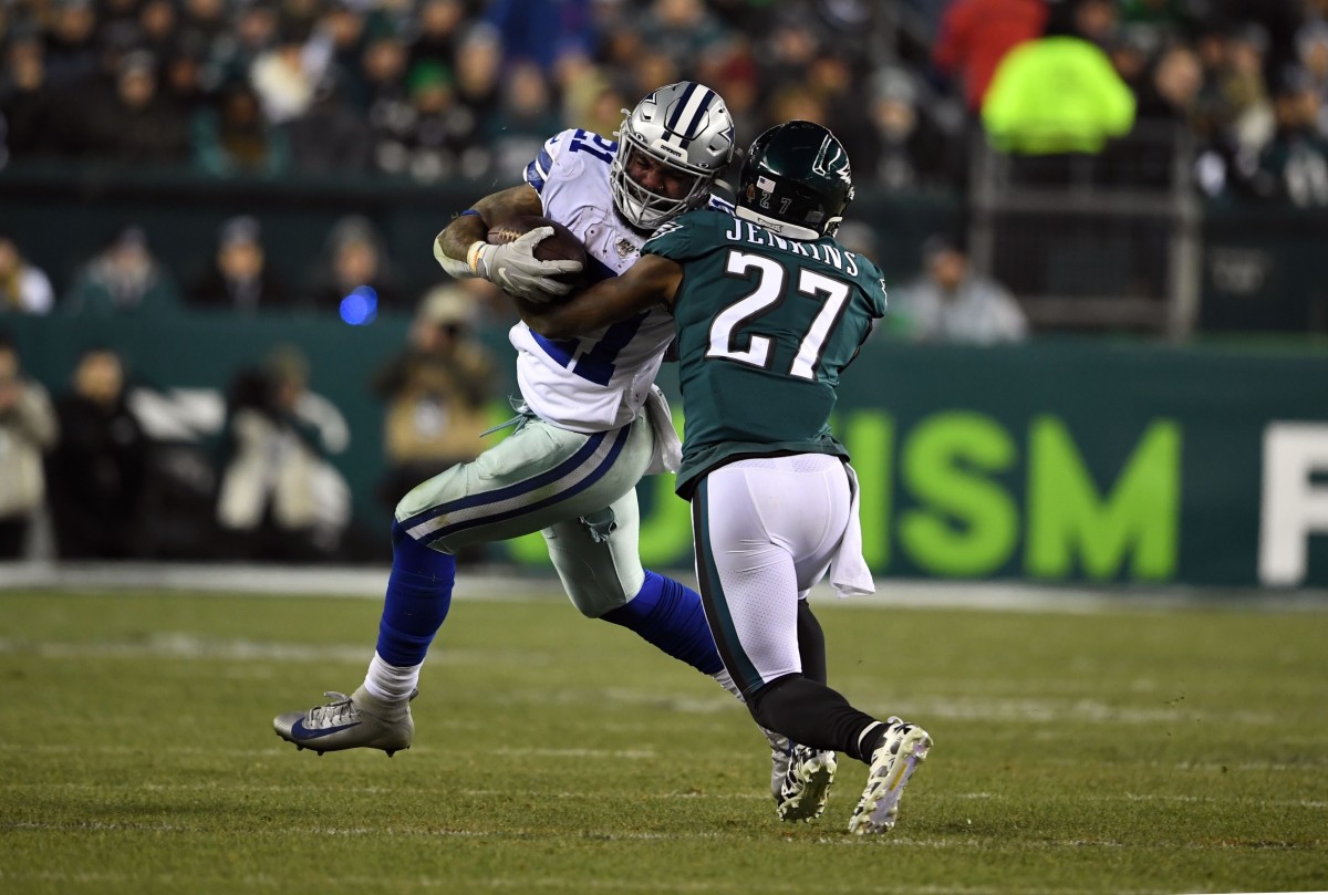 Dec 22, 2019; Philadelphia, Pennsylvania, USA; Dallas Cowboys running back Ezekiel Elliott (21) is tackled by Philadelphia Eagles strong safety Malcolm Jenkins (27) during the fourth quarter at Lincoln Financial Field. Mandatory Credit: James Lang-USA TODAY Sports