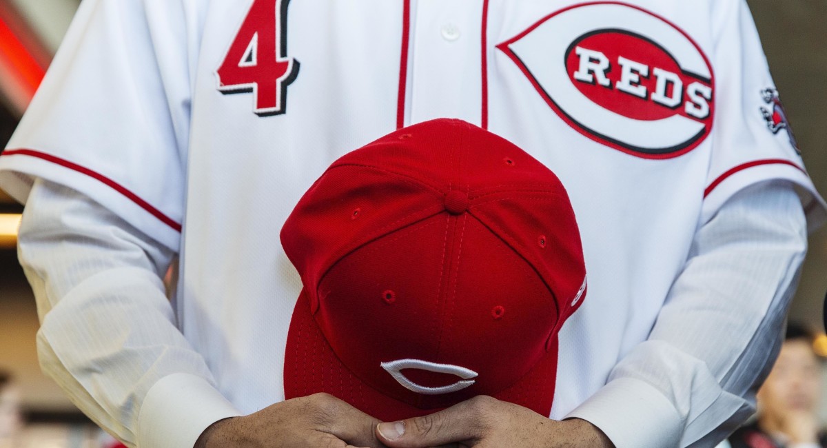 Cincinnati Reds baseball uniform and cap
