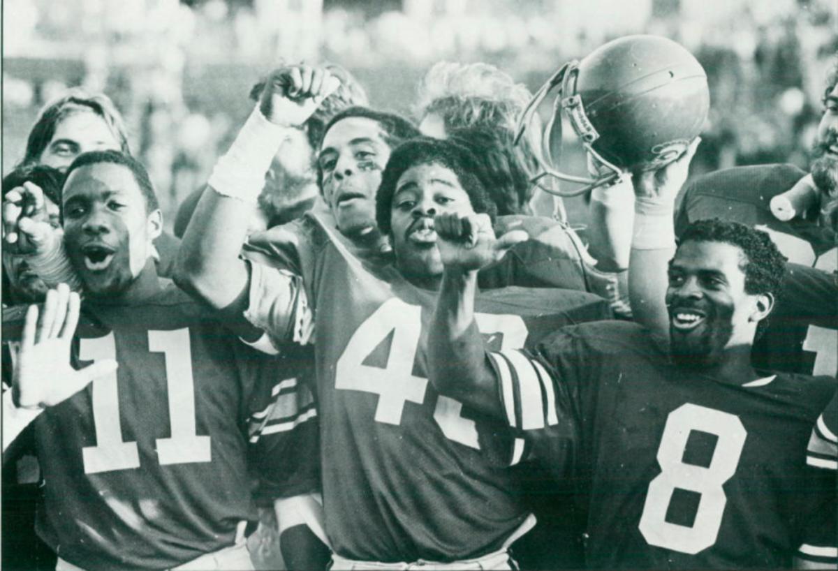 USC players Don Jones, Kenny Moore and Kevin Williams celebrate after Trojans defeated South Carolina in 1980.