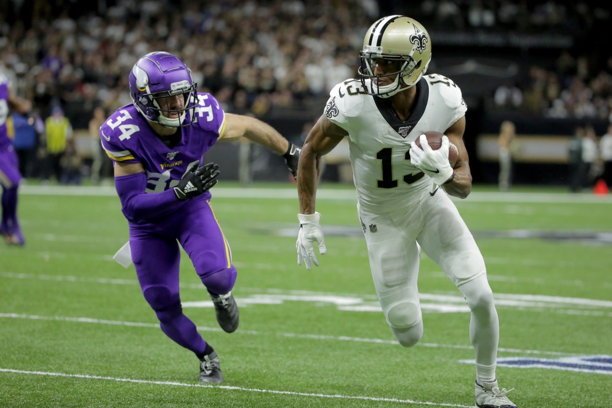 Jan 5, 2020; New Orleans, Louisiana, USA; New Orleans Saints wide receiver Michael Thomas (13) runs after a pass reception against Minnesota Vikings strong safety Andrew Sendejo (34) during the first quarter of a NFC Wild Card playoff football game at the Mercedes-Benz Superdome. Mandatory Credit: Derick Hingle-USA TODAY