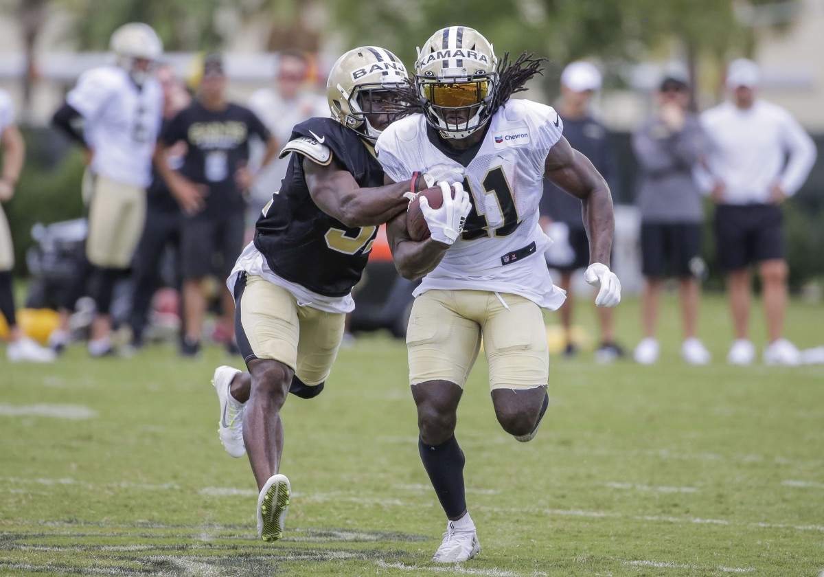 Jul 28, 2019; Metairie, LA, USA; New Orleans Saints running back Alvin Kamara (41) pulls away from defensive back Chris Banjo (31) during training camp at the Ochsner Sports Performance Center. Mandatory Credit: Derick E. Hingle-USA TODAY Sports