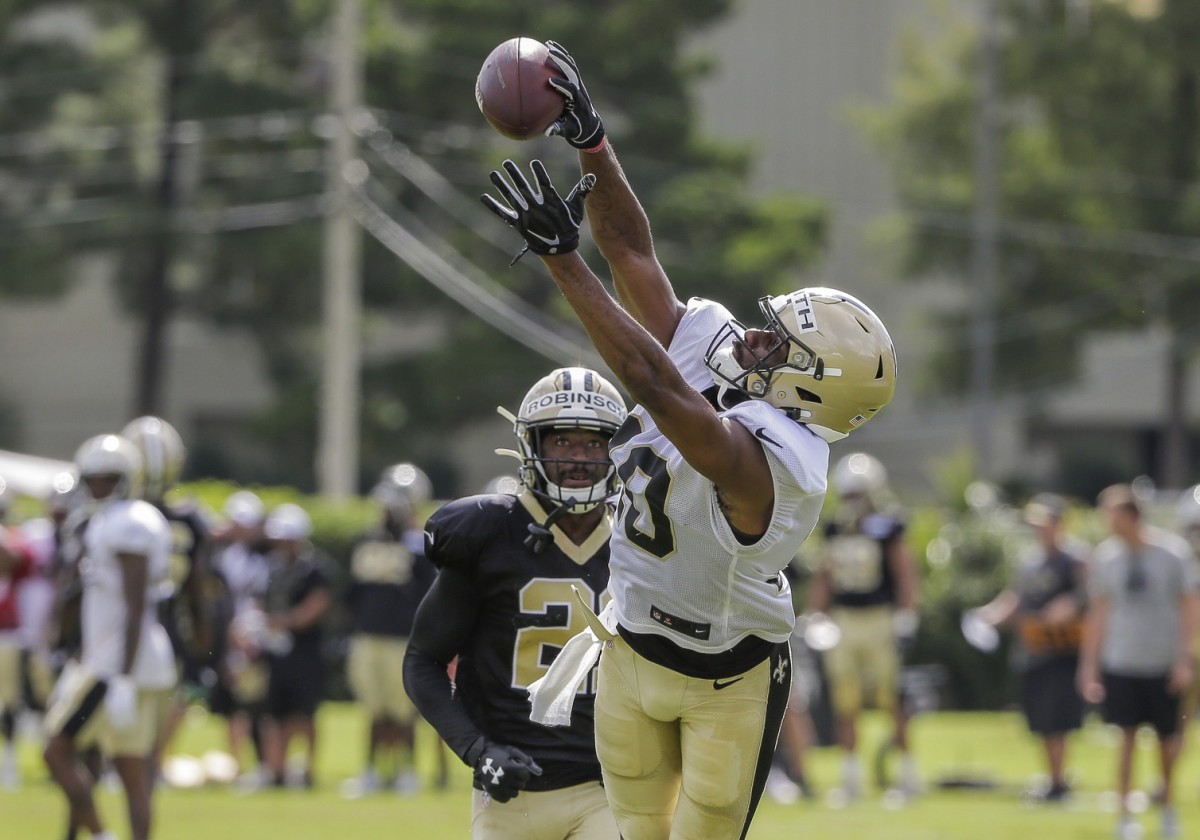 Jul 28, 2019; Metairie, LA, USA; New Orleans Saints wide receiver Tre'Quan Smith (10) catches a pass over defensive back Patrick Robinson (21) during training camp at the Ochsner Sports Performance Center. Mandatory Credit: Derick E. Hingle-USA TODAY