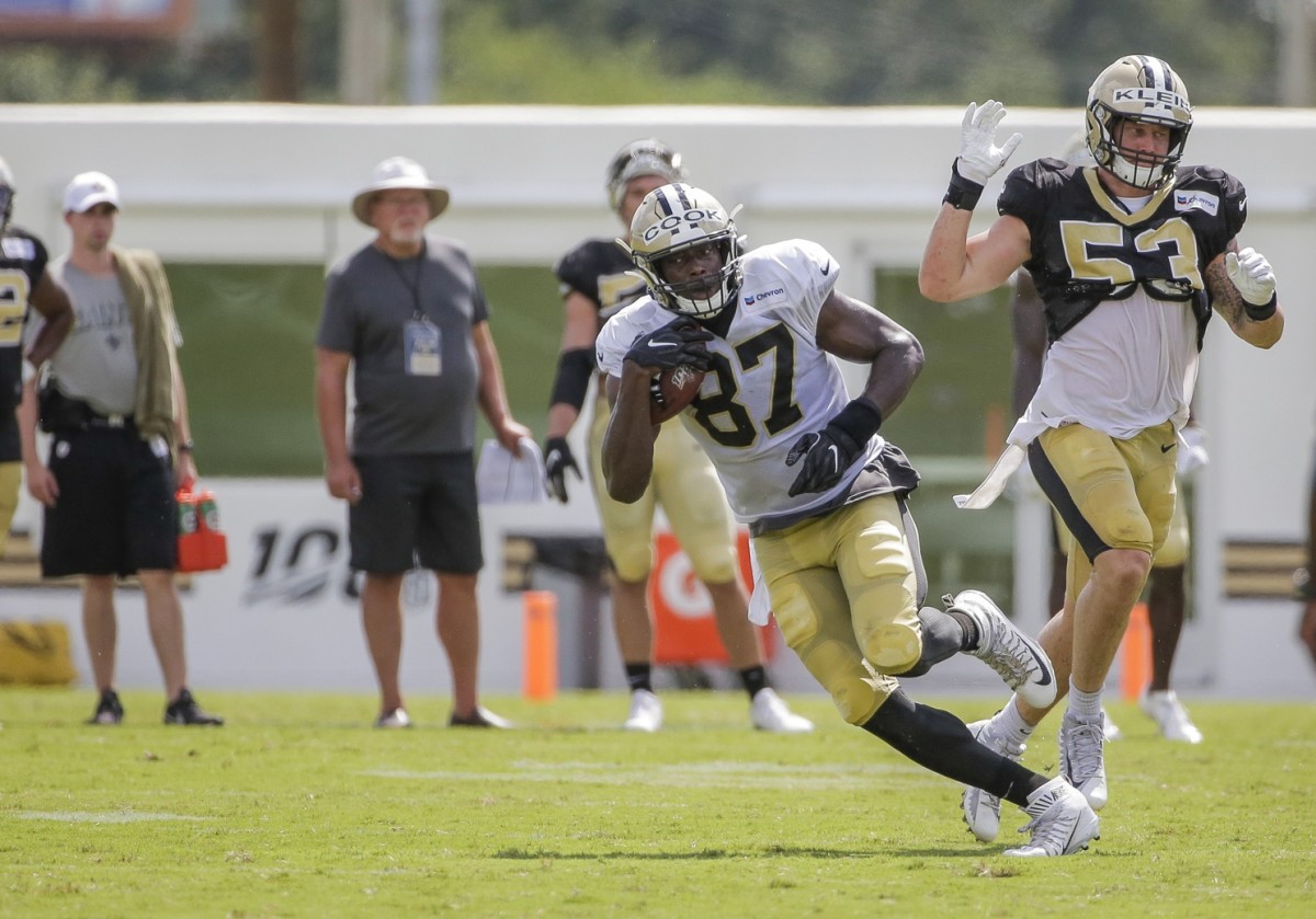 Jul 28, 2019; Metairie, LA, USA; New Orleans Saints tight end Jared Cook (87) runs past outside linebacker A.J. Klein (53) during training camp at the Ochsner Sports Performance Center. Mandatory Credit: Derick E. Hingle-USA TODAY Sports