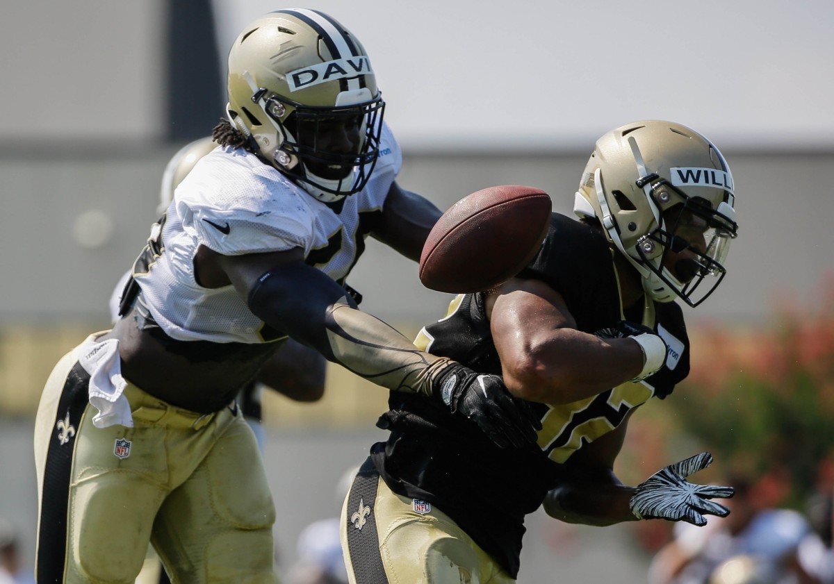 Jul 28, 2018; Metairie, LA, USA; New Orleans Saints linebacker Demario Davis (56) forces a fumble by running back Jonathan Williams (32) during training camp at New Orleans Saints Training Facility. Mandatory Credit: Derick E. Hingle-USA TODAY