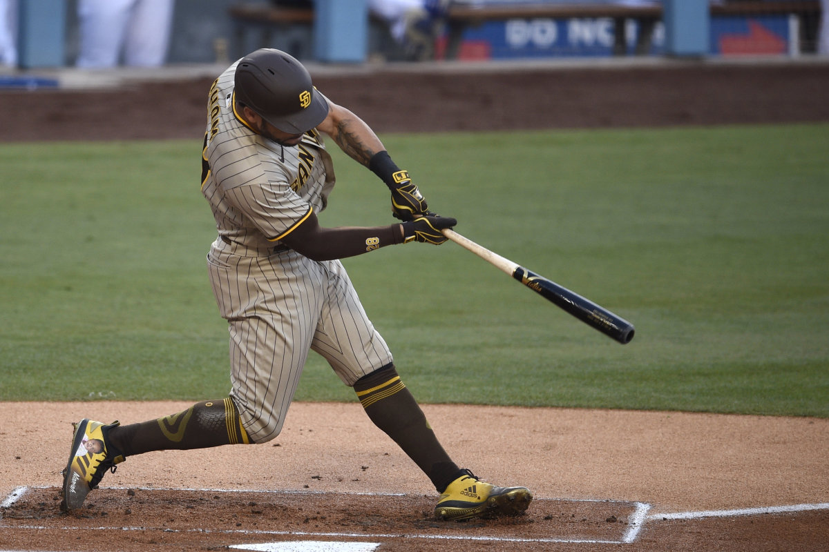 San Diego Padres left fielder Tommy Pham (28) hits a solo home run during the first inning against the Los Angeles Dodgers at Dodger Stadium. Credit: Kelvin Kuo-USA TODAY Sports