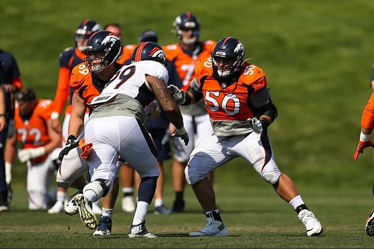 Pat Morris blocks Jurrell Casey on Day 2 of Broncos camp.