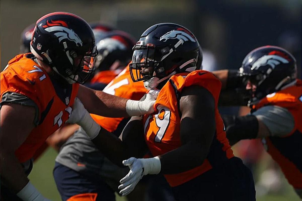 Austin Schlottmann and Lloyd Cushenberry clash in an O-line drill on Day 1 of Broncos camp.