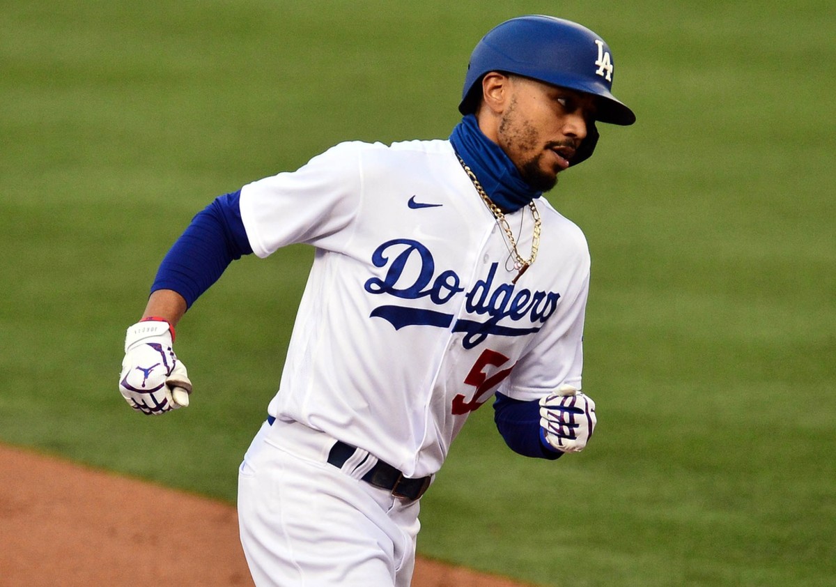 August 17, 2020; Los Angeles, California, USA; Los Angeles Dodgers right fielder Mookie Betts (50) rounds the bases after hitting a solo home run against the Seattle Mariners during the first inning at Dodger Stadium. Mandatory Credit: Gary A. Vasquez-USA TODAY Sports