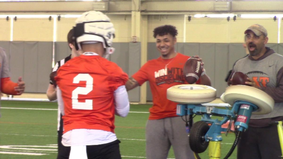 Kasey Dunn feeding the Juggs machine for receiver Tylan Wallace with Tracin Wallace assisting.