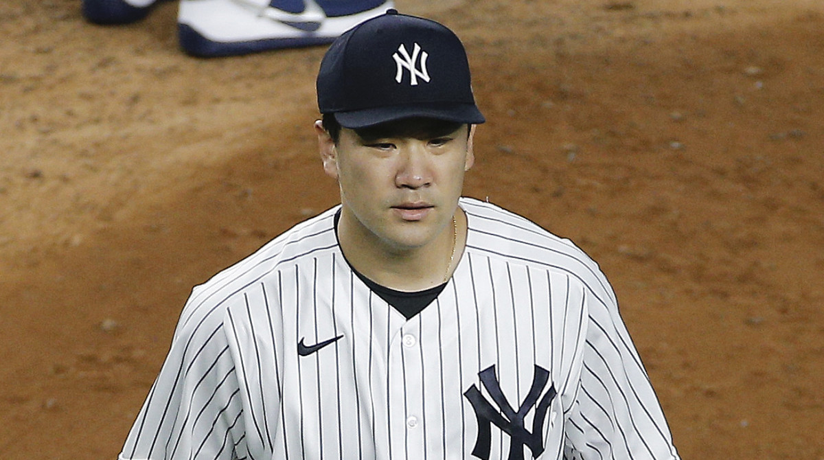New York Yankees starting pitcher Masahiro Tanaka (19) leaves the mound after being taken out of the game against the Tampa Bay Rays during the fifth inning at Yankee Stadium.