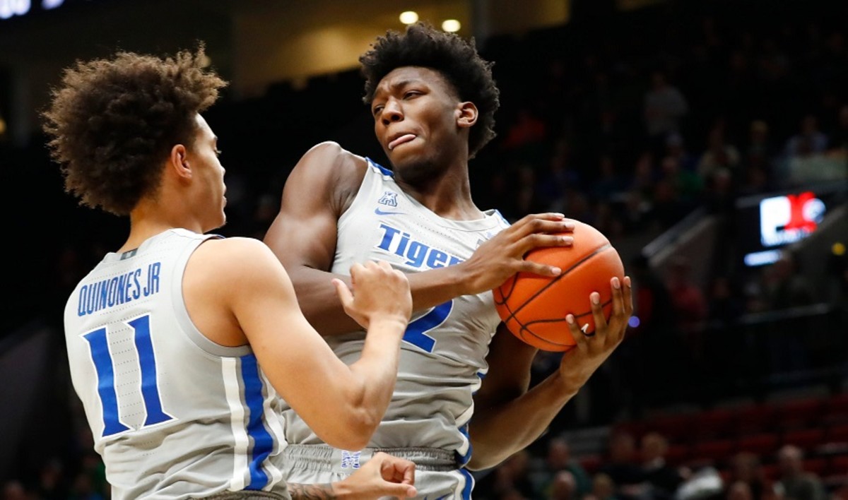 Memphis Tigers center James Wiseman grabs a rebound next to teammate Lester Quinones during their game against the Oregon Ducks at the Moda Center in Portland.