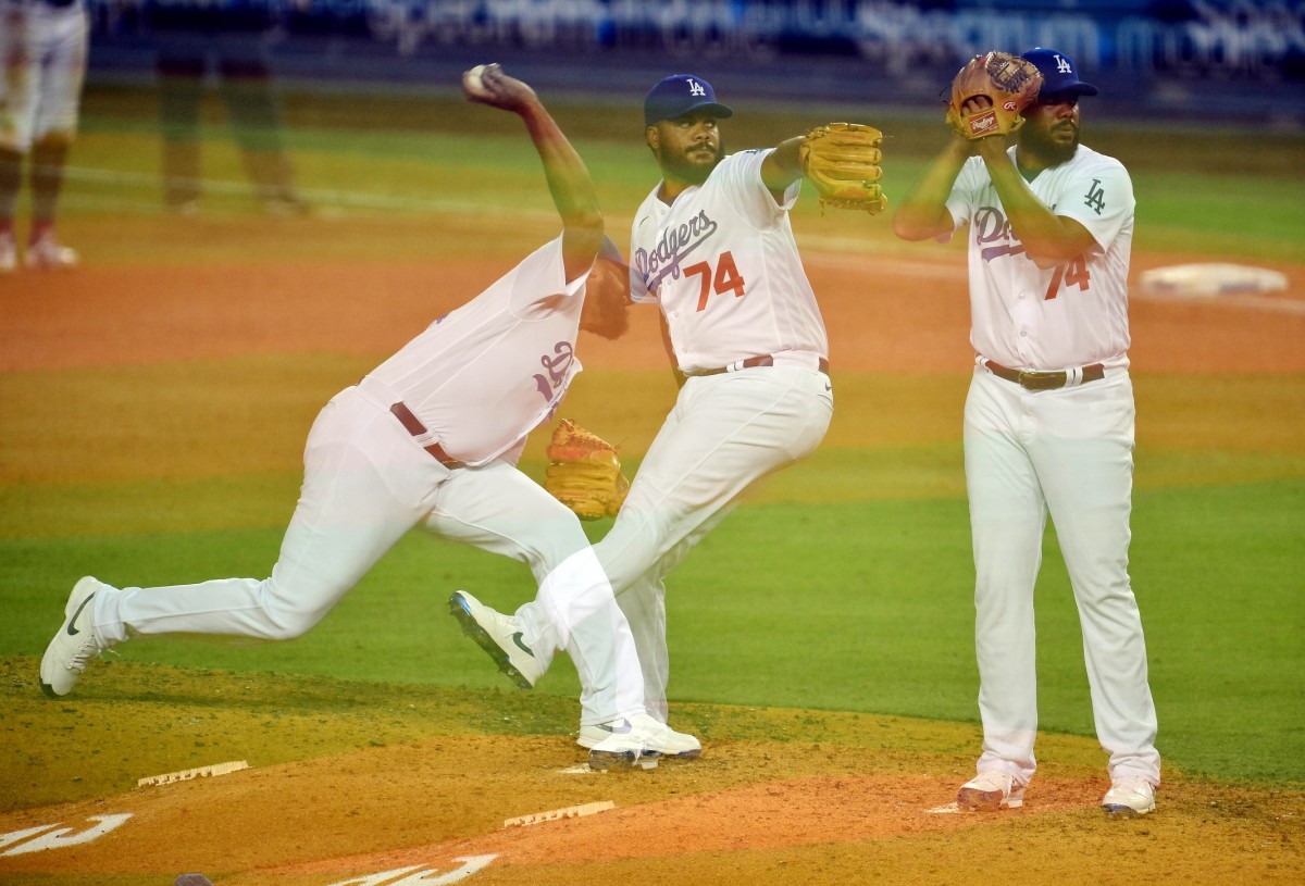 August 21, 2020; Los Angeles, California, USA; (Editors note: Multiple exposure image) Los Angeles Dodgers relief pitcher Kenley Jansen (74) throws against the Colorado Rockies during the ninth inning at Dodger Stadium. Mandatory Credit: Gary A. Vasquez-USA TODAY Sports