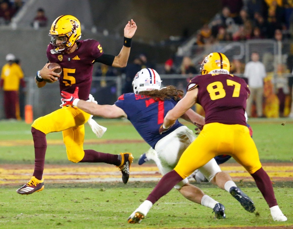 ASU quarterback Jaden Evans escapes pressure vs. Arizona