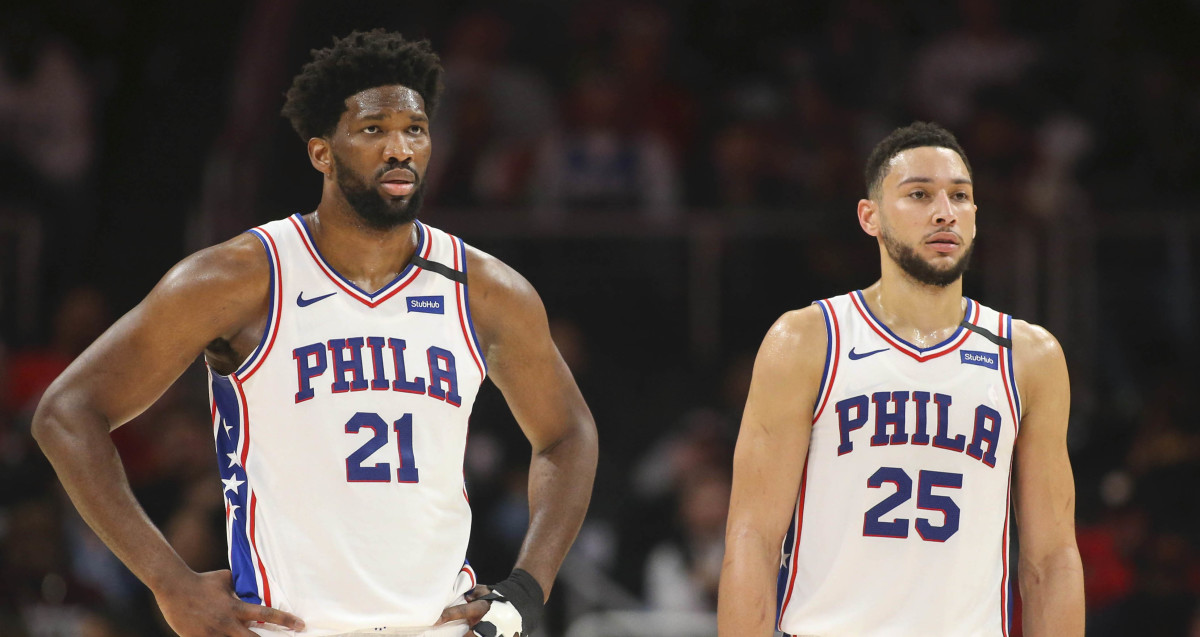 Philadelphia 76ers center Joel Embiid (21) and guard Ben Simmons (25) during a free throw against the Atlanta Hawks in the second quarter at State Farm Arena.