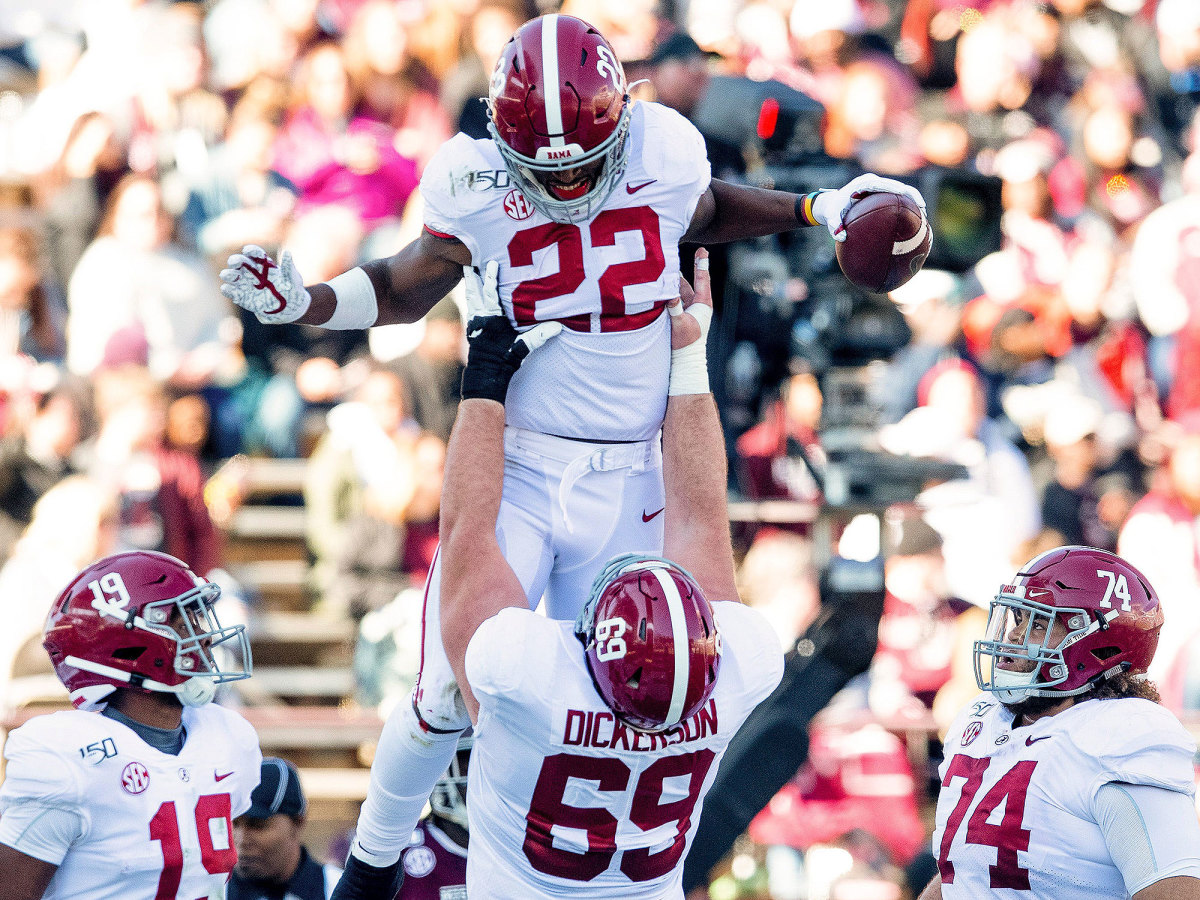 Alabama running back Najee Harris is lifted up after a touchdown