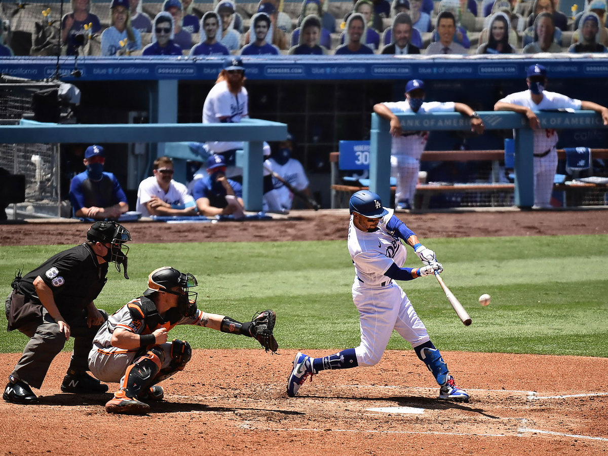 Mookie Betts swings at a pitch