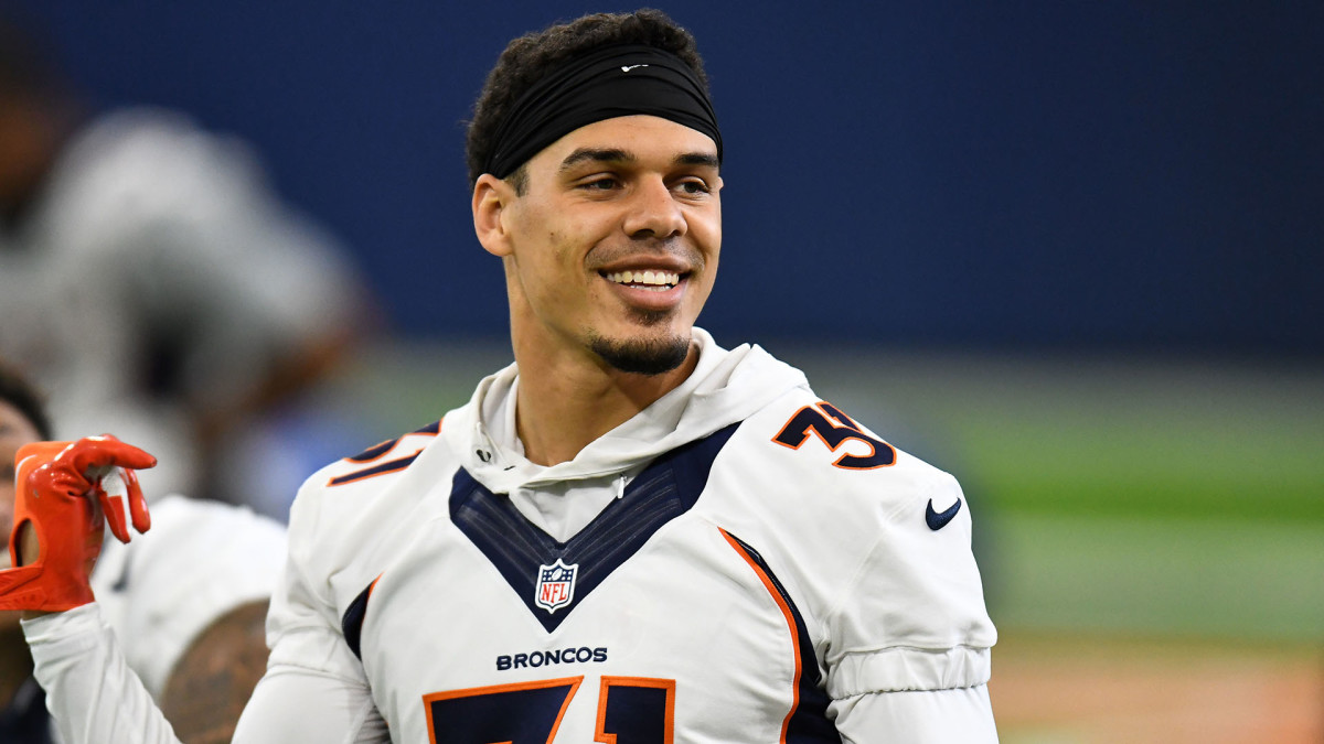 Denver Broncos safety Justin Simmons smiles during a training camp practice