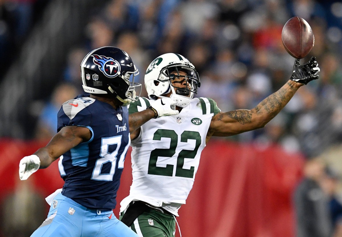 Jets cornerback Trumaine Johnson (22) breaks up a pass intended for Titans wide receiver Corey Davis (84) in the third quarter at Nissan Stadium Sunday, Dec. 2, 2018 © Andrew Nelles / Tennessean.com
