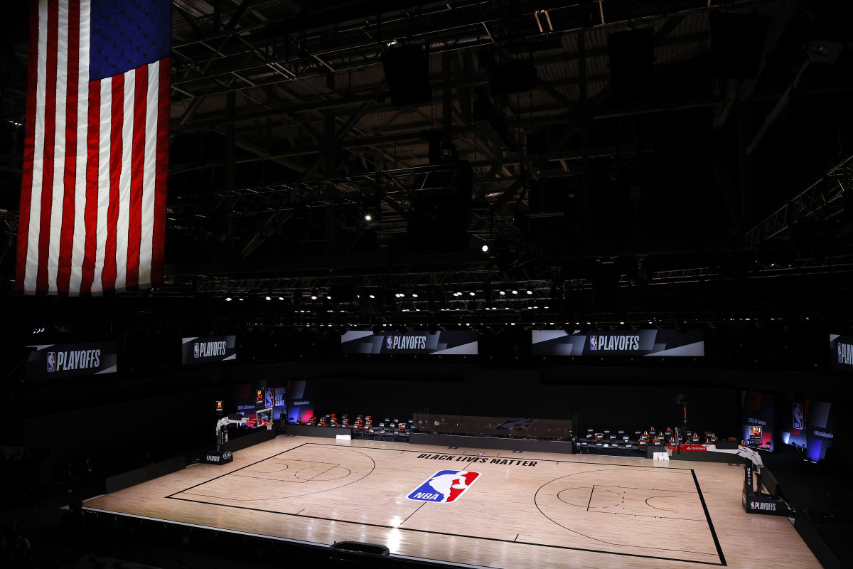 An empty court and bench is shown with no signage following the scheduled start time in Game Five of the Eastern Conference First Round between the Milwaukee Bucks and the Orlando Magic