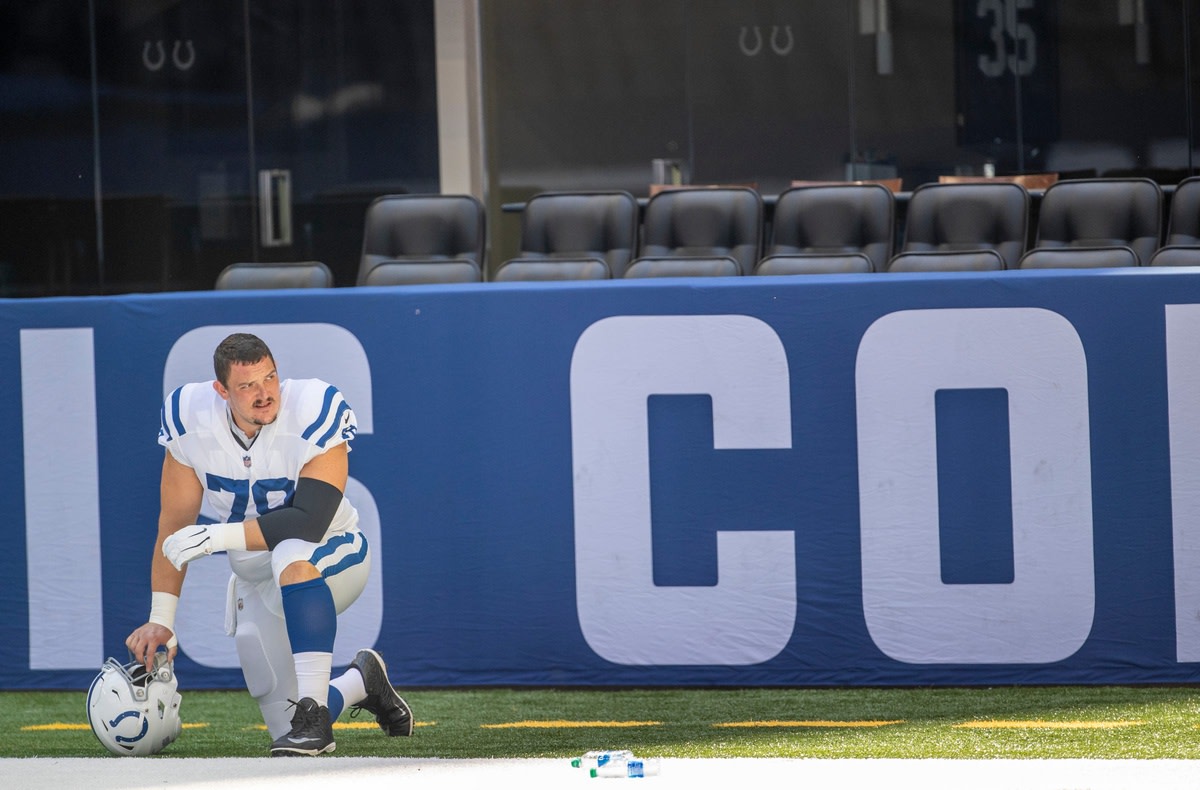 Indianapolis Colts center Ryan Kelly takes a knee before a Monday practice at Lucas Oil Stadium.