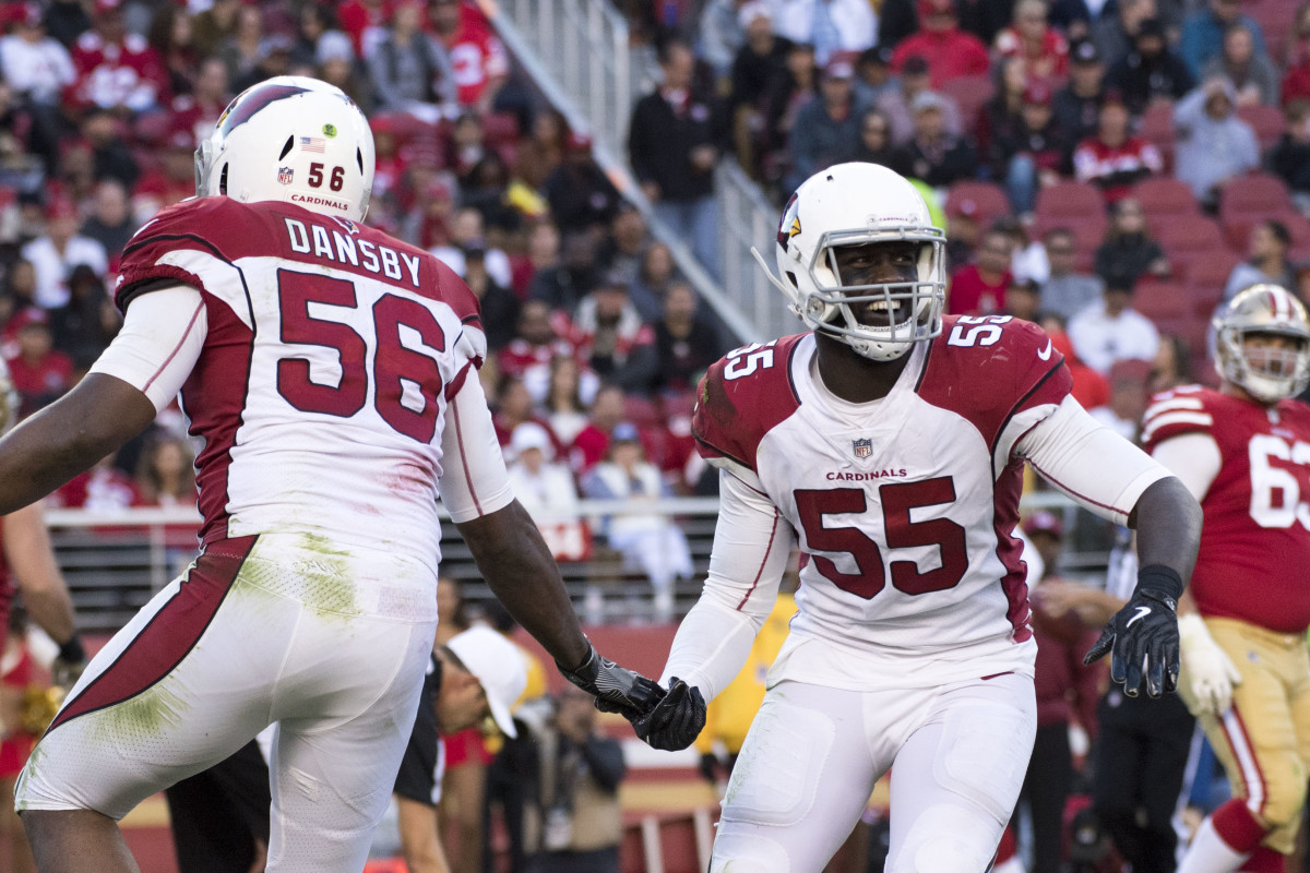 Cardinals outside linebacker Chandler Jones (55) is congratulated by inside linebacker Karlos Dansby (56) for a defensive stop against the 49ers during the fourth quarter at Levi's Stadium, Nov. 5, 2017.