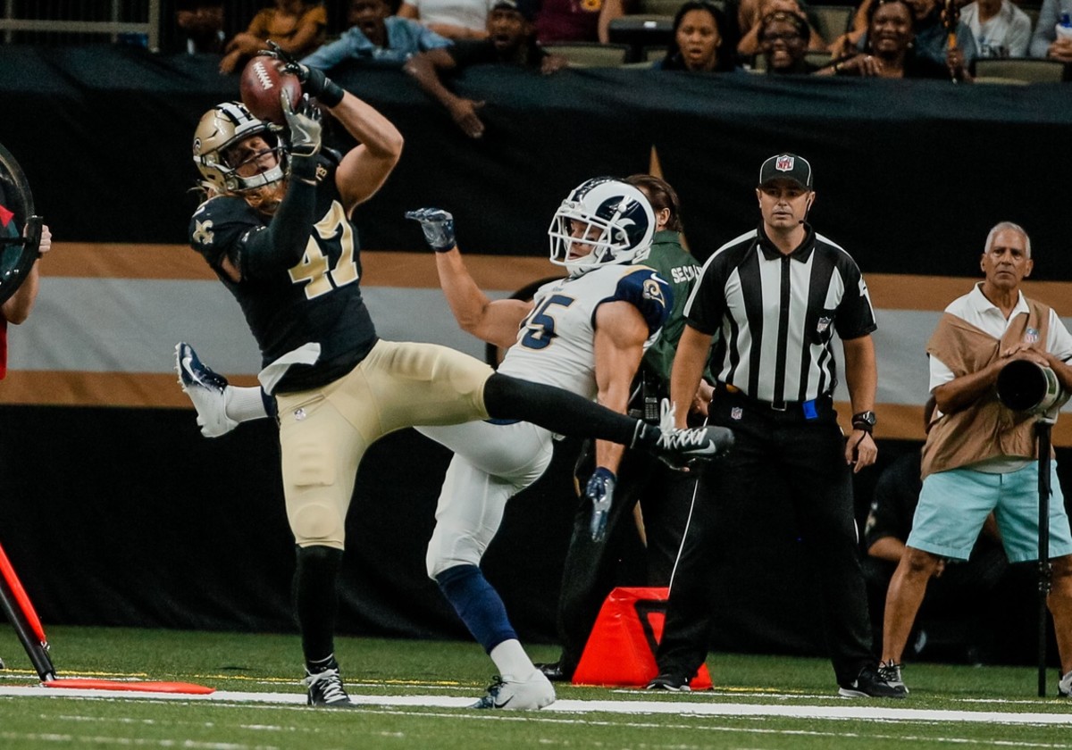 Aug 30, 2018; New Orleans, LA, USA; New Orleans Saints linebacker Alex Anzalone (47) intercepts a pass in front of Los Angeles Rams running back Nick Holley (25) during the first half of a preseason game at the Mercedes-Benz Superdome. Mandatory Credit: Derick E. Hingle-USA TODAY Sports