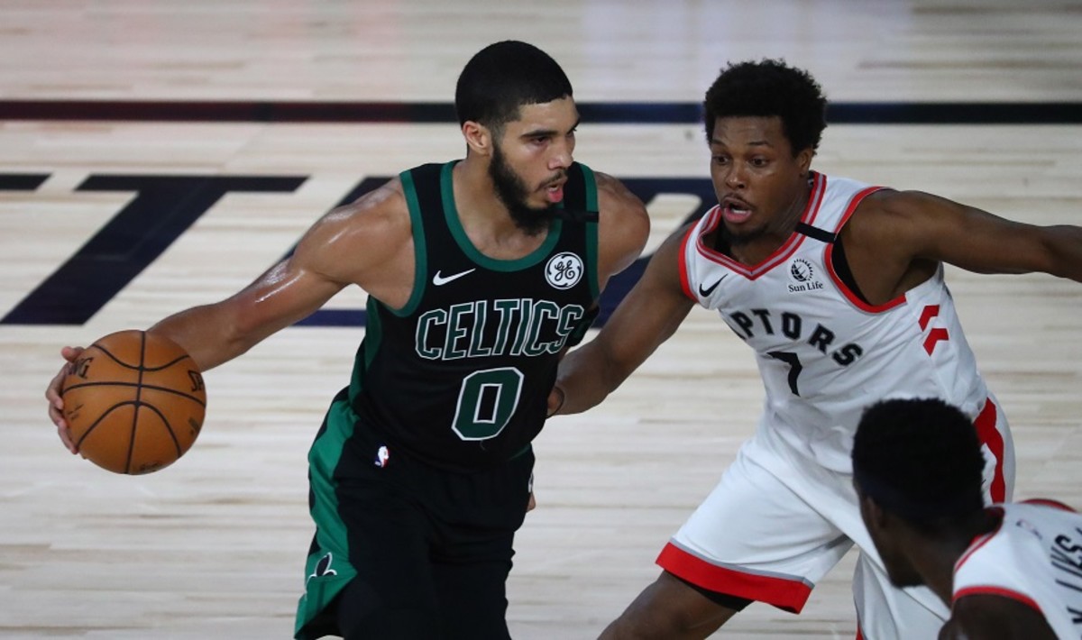 Boston Celtics forward Jayson Tatum (0) dribbles against Toronto Raptors guard Kyle Lowry (7) during the NBA Playoffs at The Field House.
