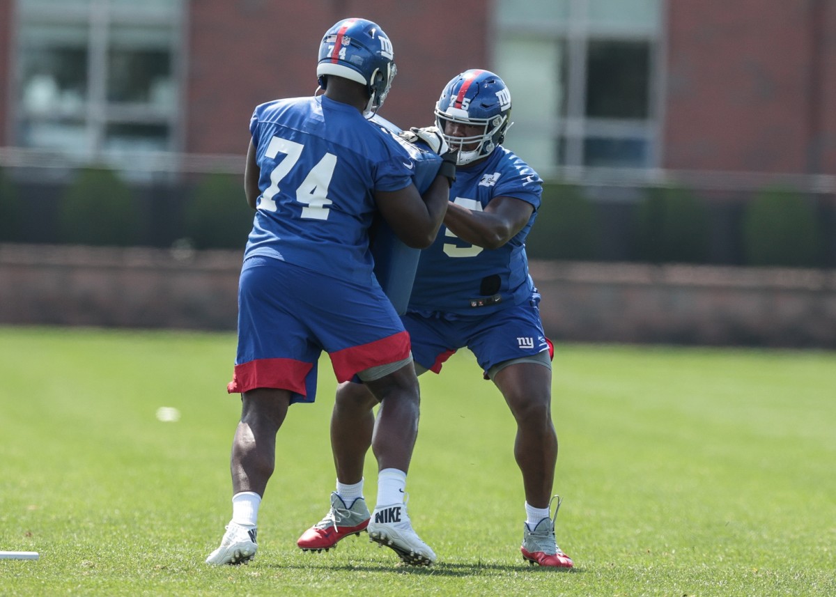Aug 23, 2020; East Rutherford, New Jersey, USA; New York Giants offensive tackle Matt Peart (74) and offensive tackle Cameron Fleming (75) participate in drills during training camp at Quest Diagnostics Training Center.