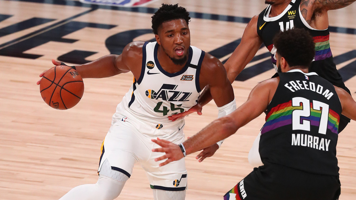 Donovan Mitchell dribbles against the Denver Nuggets