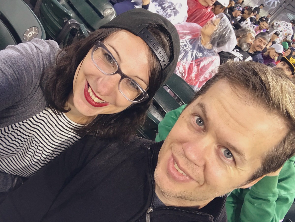 Cold and rainy birthday baseball with my husband (and new hat).