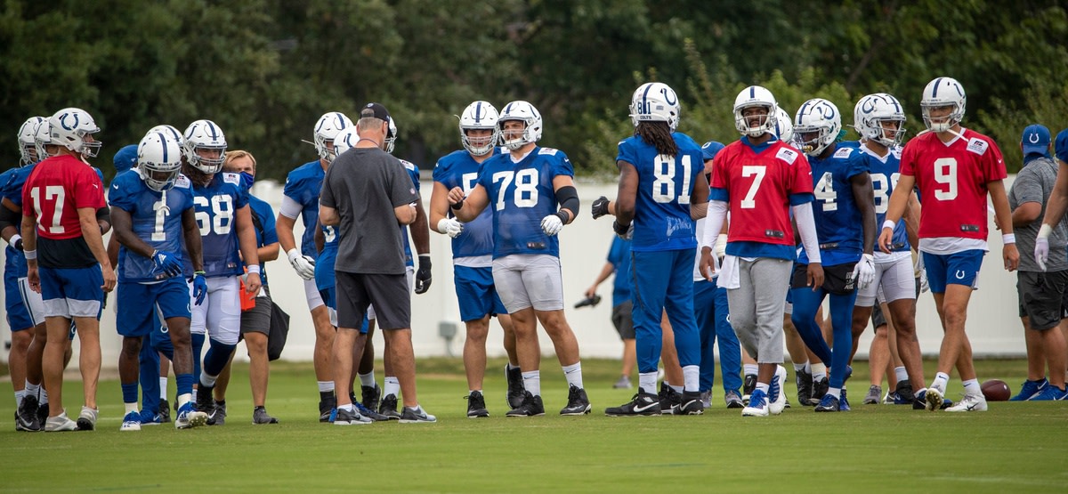 Indianapolis Colts head coach Frank Reich (gray shirt) talks to players during Thursday's final preseason practice.