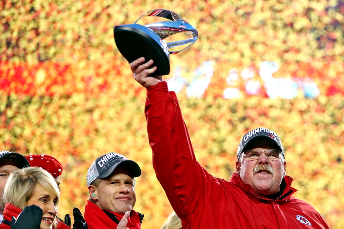 Jan 19, 2020; Kansas City, Missouri, USA; Kansas City Chiefs head coach Andy Reid celebrates with the Lamar Hunt Trophy after beating the Tennessee Titans in the AFC Championship Game at Arrowhead Stadium. Mandatory Credit: Mark J. Rebilas-USA TODAY Sports