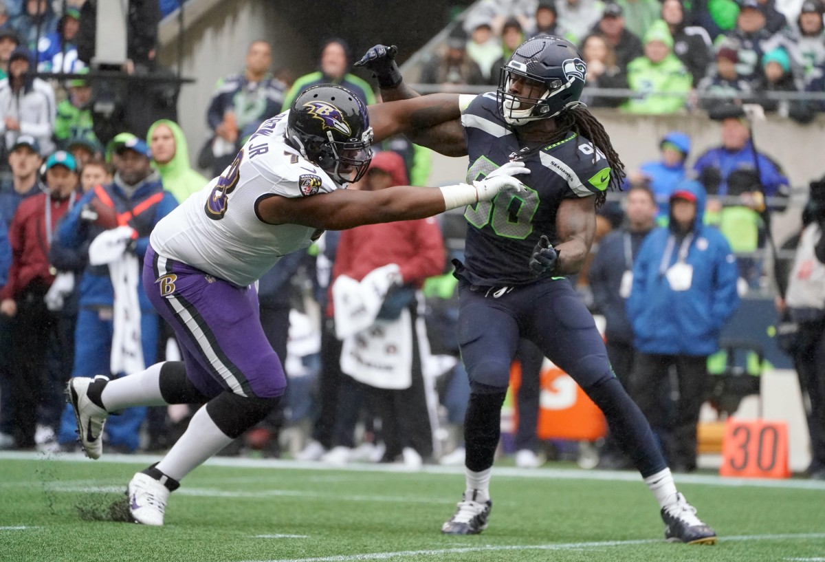 Oct 20, 2019; Seattle, WA, USA; Seattle Seahawks outside linebacker Jadeveon Clowney (90)attempts to get past Baltimore Ravens offensive tackle Orlando Brown (78) in the first half at CenturyLink Field. Mandatory Credit: Kirby Lee-USA TODAY
