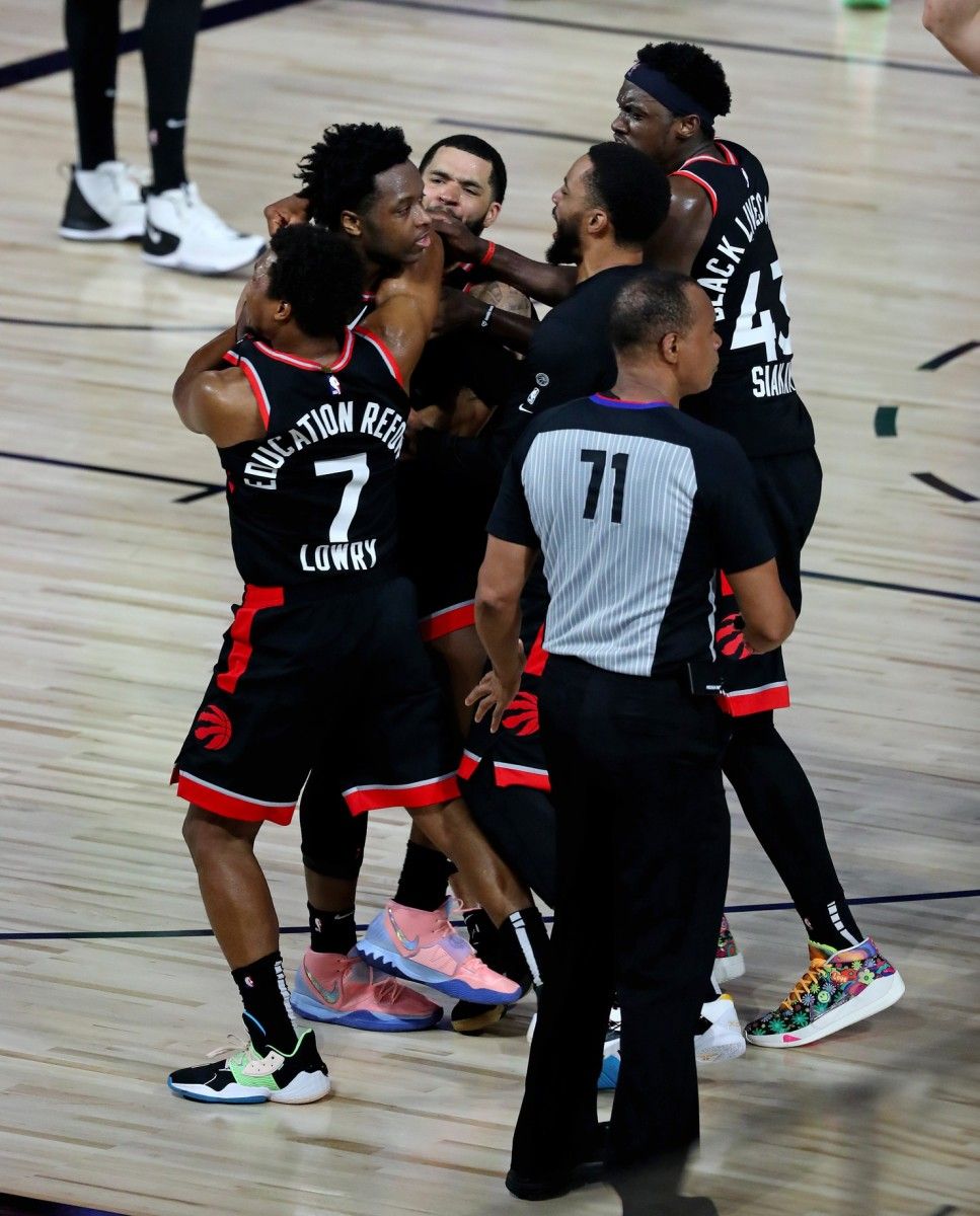 OG Anunoby is surrounded by his Toronto Raptors' teammates after hitting a game-winning shot on Thursday night. (USA TODAY Sports)