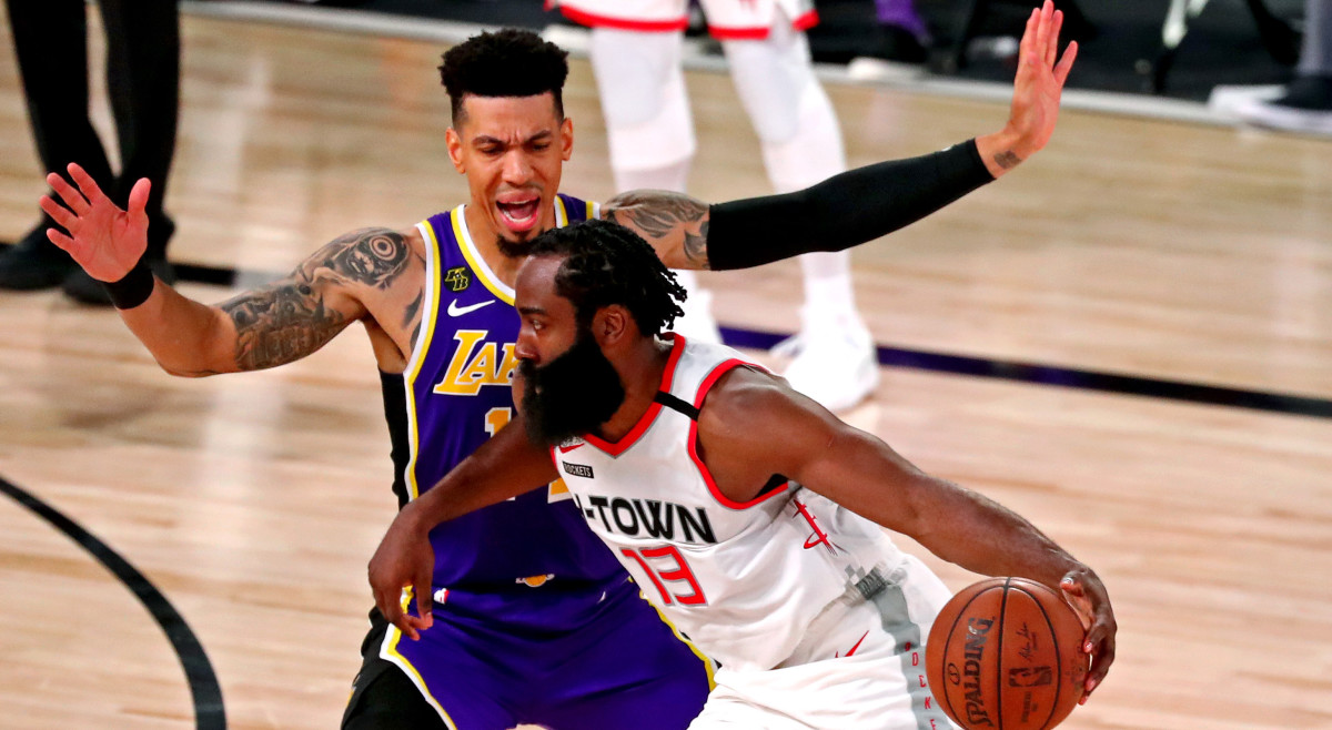 Houston Rockets guard James Harden (13) drives to the basket against Los Angeles Lakers guard Danny Green (14) during the fourth quarter in game one of the second round of the 2020 NBA Playoffs