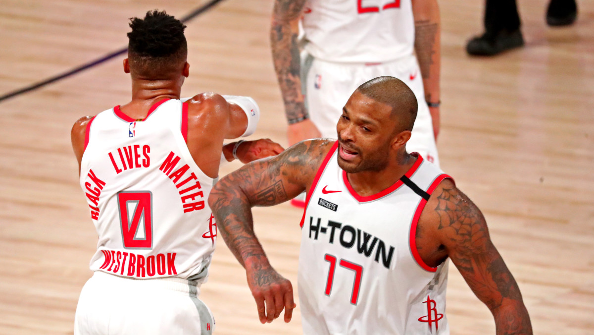 Houston Rockets guard Russell Westbrook (0) celebrates with Houston Rockets forward P.J. Tucker (17) during the fourth quarter against the Los Angeles Lakers