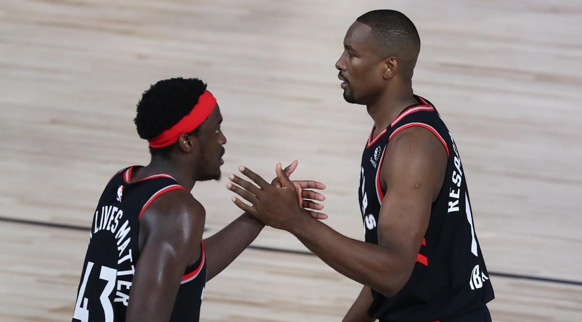Toronto Raptors forward Pascal Siakam (43) celebrates with center Serge Ibaka (right) after defeating the Boston Celtics game four in the second round of the 2020 NBA Playoffs