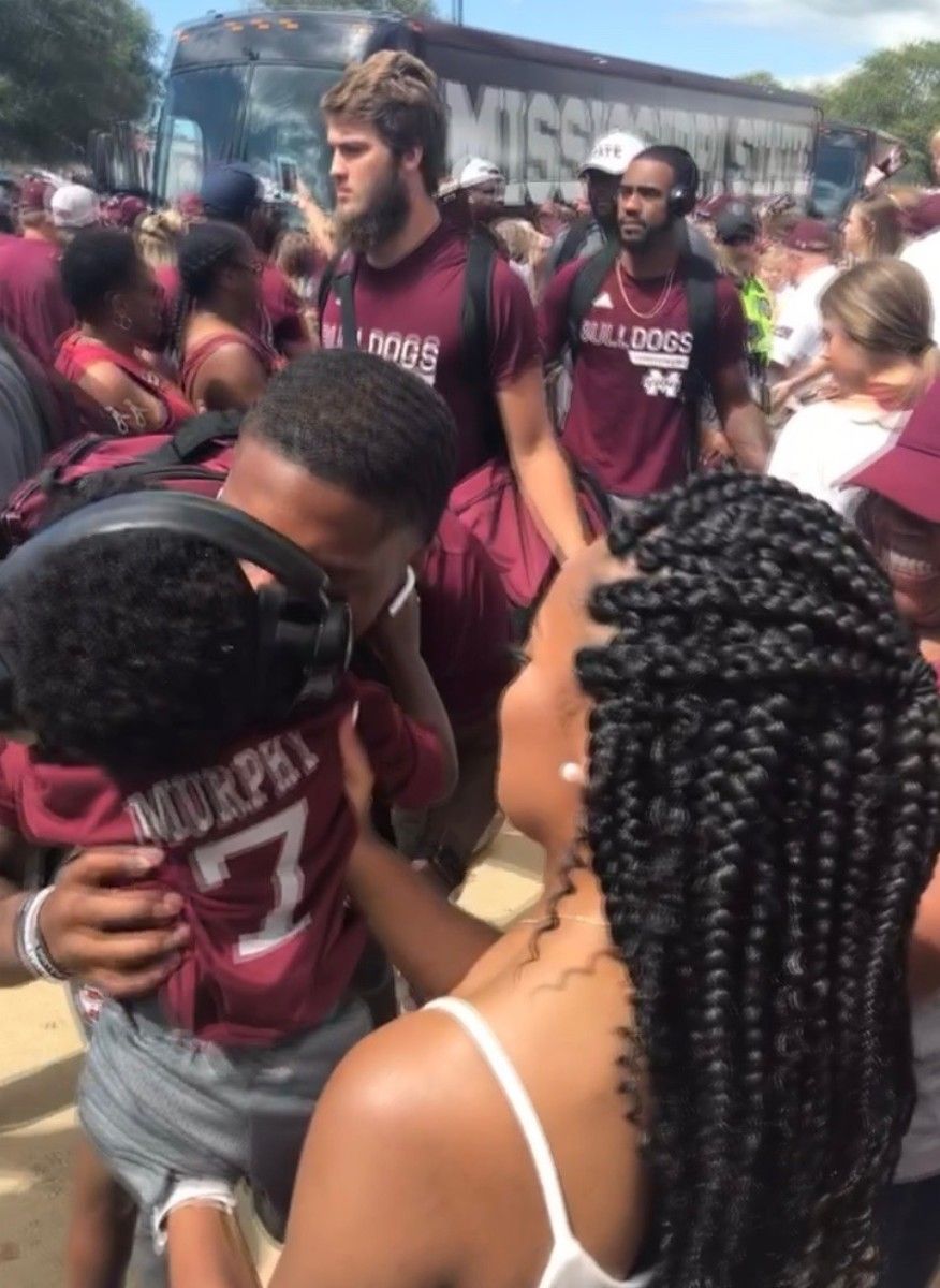 Marcus Murphy greets son, Mason, during a Dawg Walk last season. (Photo submitted by Alicia Cherry)